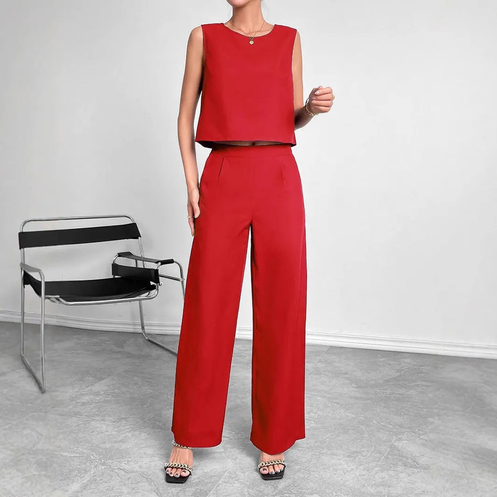 Red polyester two-piece set with sleeveless round neck top and wide leg trousers