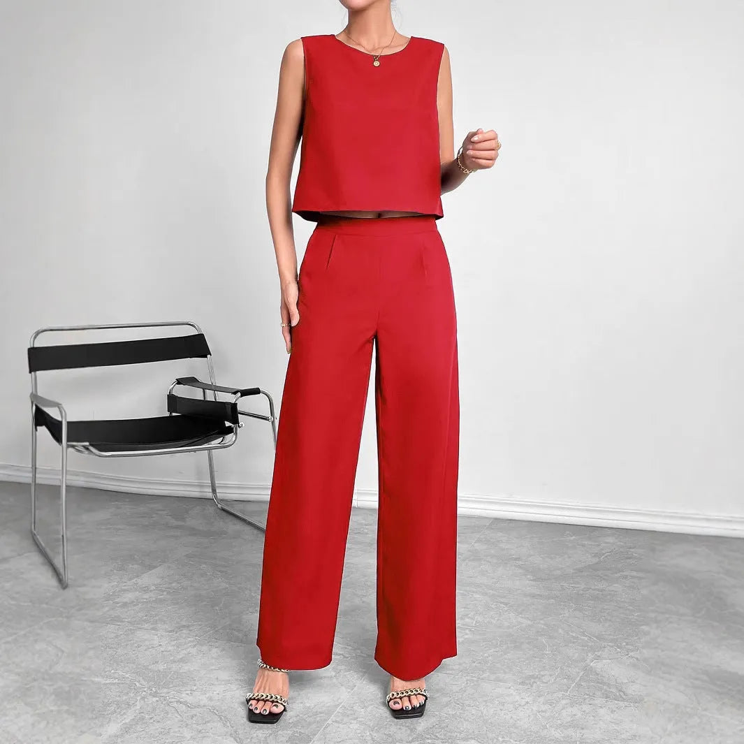 Red polyester two-piece set with sleeveless round neck top and wide leg trousers