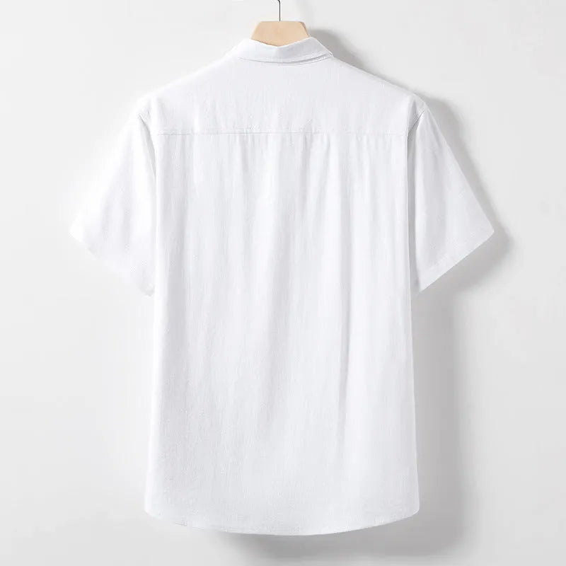 Man modelling a loose-fit linen blend T-shirt in optic linen colour, short sleeves.