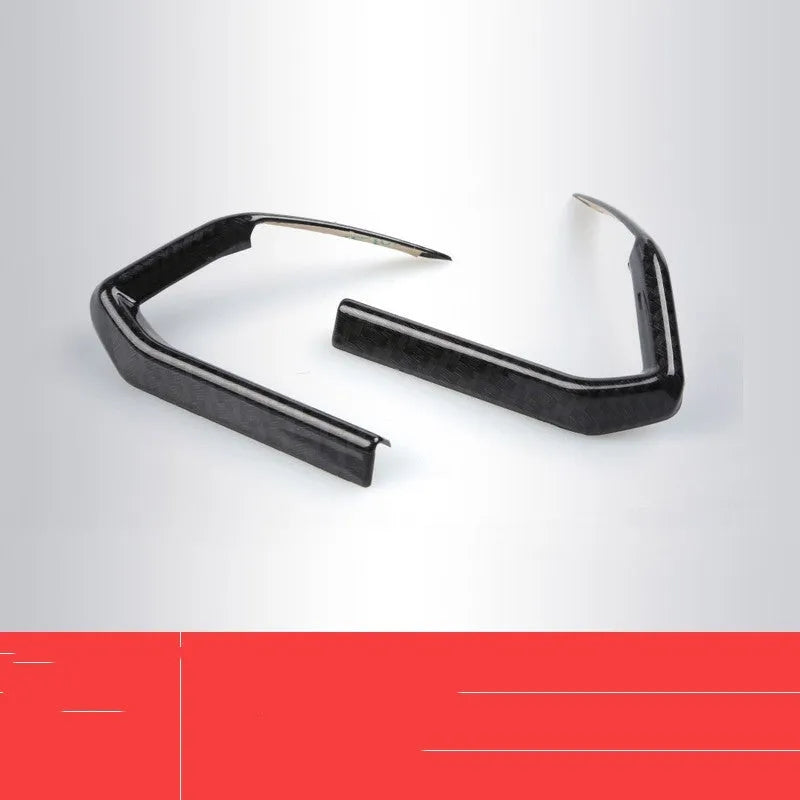 Pair of black ABS plastic steering wheel frame trims with adhesive backing for non-destructive car interior installation