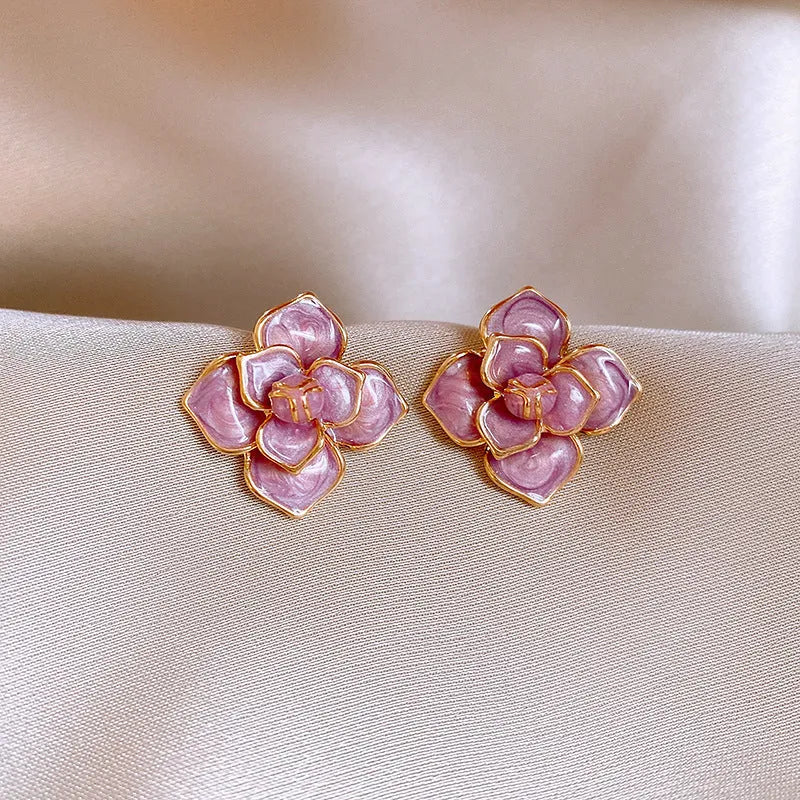 Gold plated purple oil-spot glaze flower stud earrings on copper base with floral design