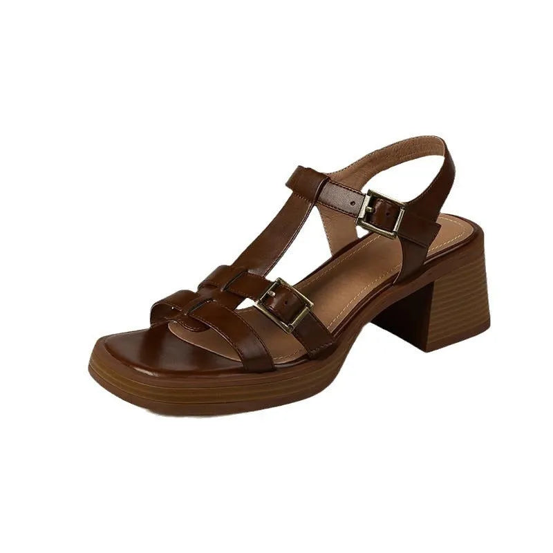 Black retro women's sandals with T-buckle, chunky platform heel and open square toe.