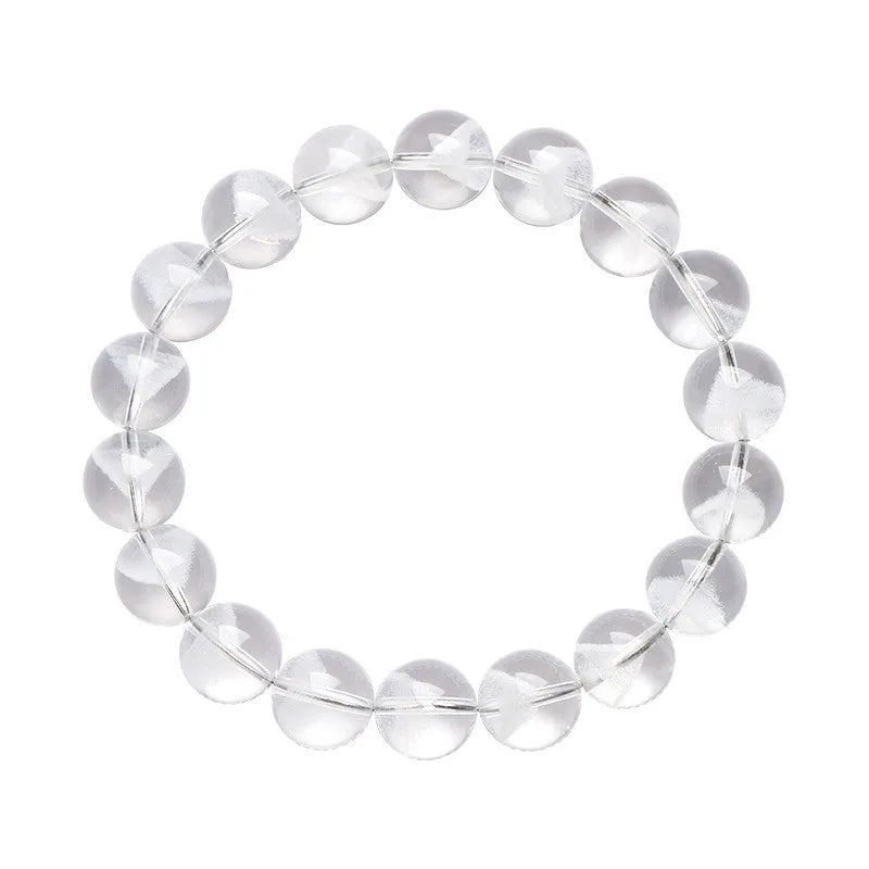 Women's natural white crystal ghost pyramid bracelet with Ruyi design on a model's wrist