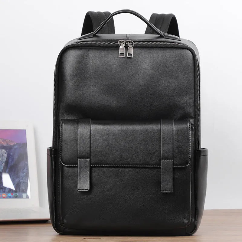 Black leather computer backpack with woven detailing and 36-55L capacity for business commute
