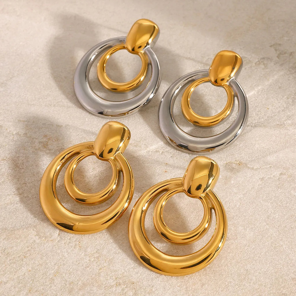 Golden round double layer hollow stud earrings with geometric design and hypoallergenic titanium steel construction