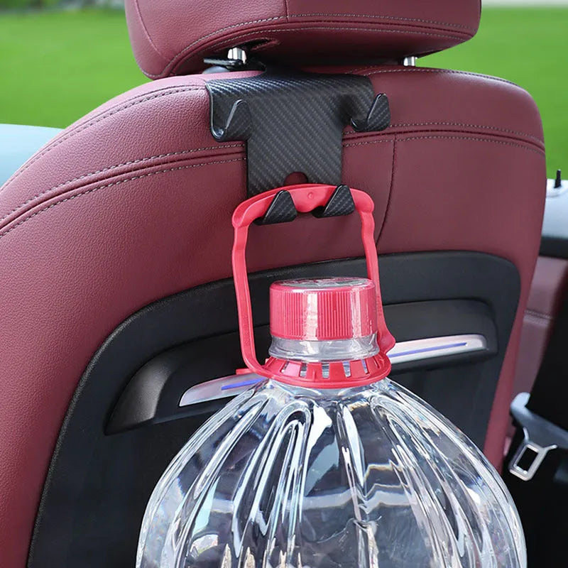 Black ABS car hook with integrated mobile phone bracket for rear seat storage.