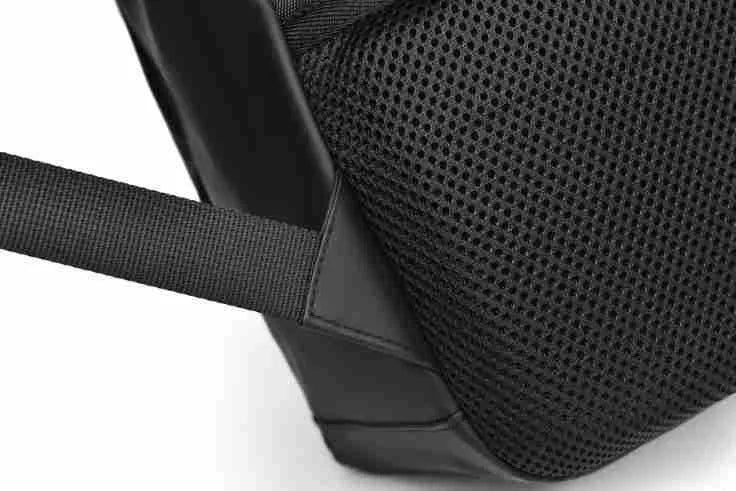 Large waterproof backpack in PU leather with sewing thread detailing, includes computer bag