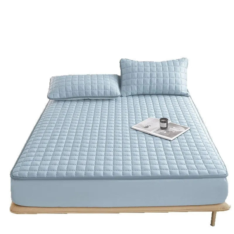 Class A waterproof fitted sheet in washed cotton, shown in light grey colour on a child's mattress.