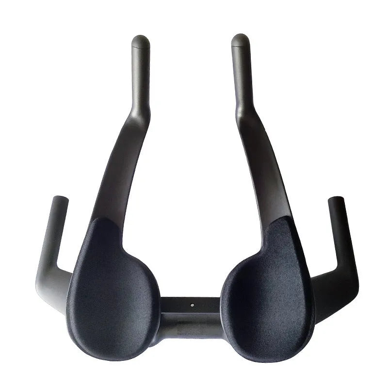 Black carbon fibre bicycle time trial handlebar showing aero profile and 31.8mm clamp area.