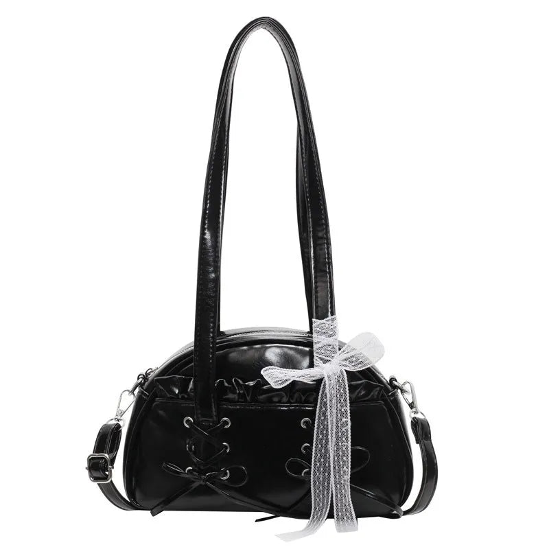 Women's milky white PU shoulder bag with bandage bow and stitching detail, showing internal phone pocket.