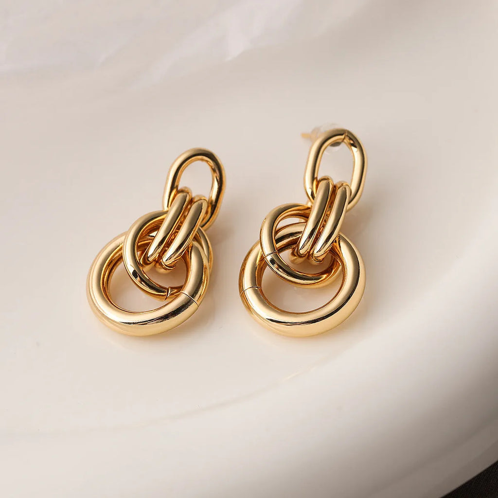 Women's gold geometric earrings with an irregular shape and high-profile INS design.
