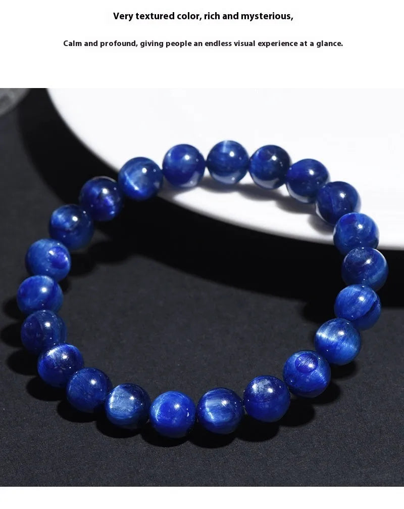 Natural blue crystal bead bracelet with geometric design and polished finish on a wrist.