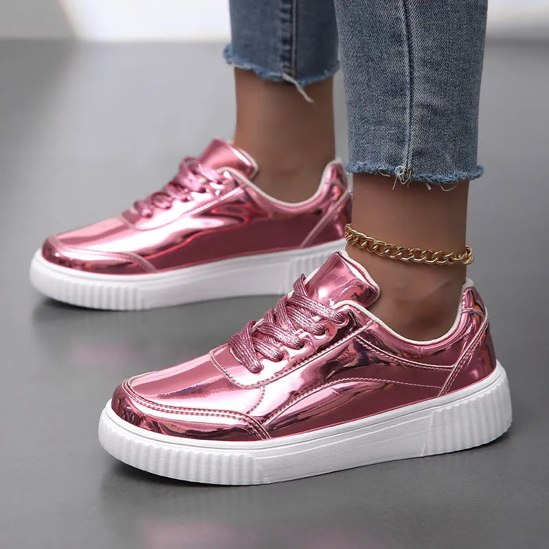 Rose gold and gold sequinned platform sneakers with round toe and thick MD sole.