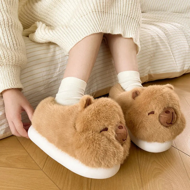 Light brown women's winter slippers with plush upper, artificial wool lining, and slip-on design
