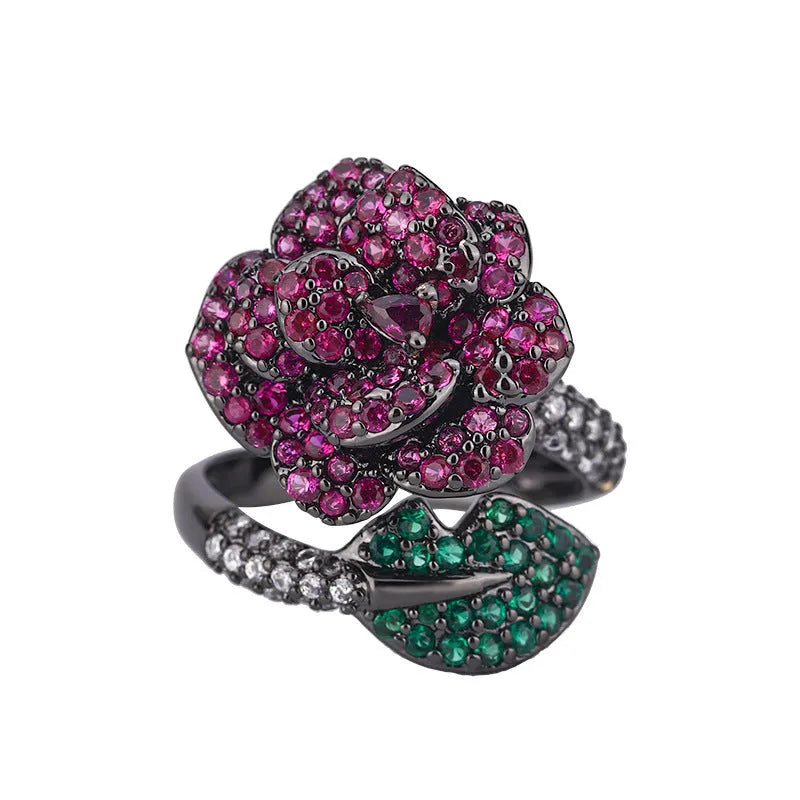 Black gold geometric floral ring with diamond-treated red corundum stone on copper band