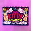 A4 cat wall calendar showing a monthly page with a cat photograph and date grid