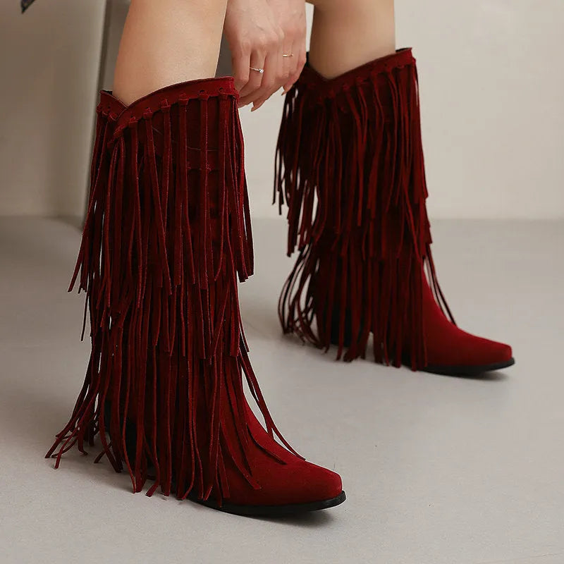 Women's beige suede high boots with tassel detail, chunky heel, and square toe on a waterproof platform sole.