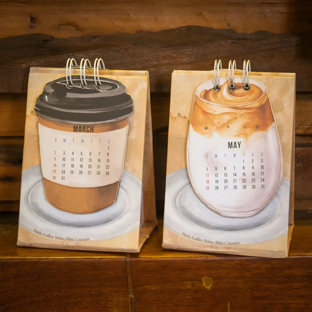 Mini paper desk calendar for 2025 with simple modern design and themed options
