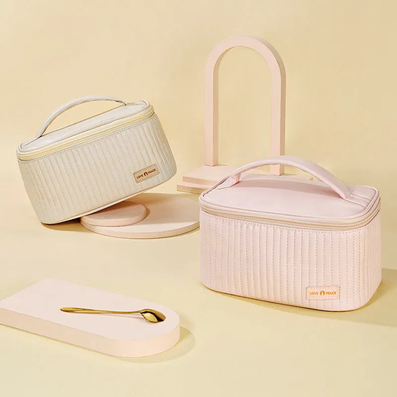 Open-top round cake makeup bag in a choice of six solid colours made from PU leather.