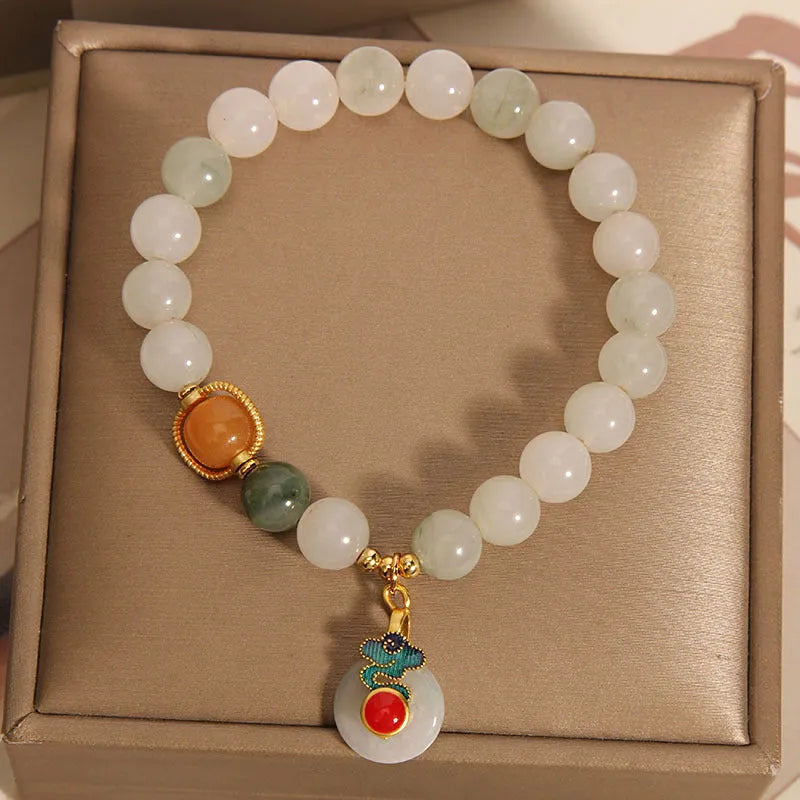 Women's ice jade bracelet with pearl detailing and traditional jade buckle