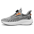 Men's white and green running shoes with rotating buckle and mesh upper on a flat TPU sole.