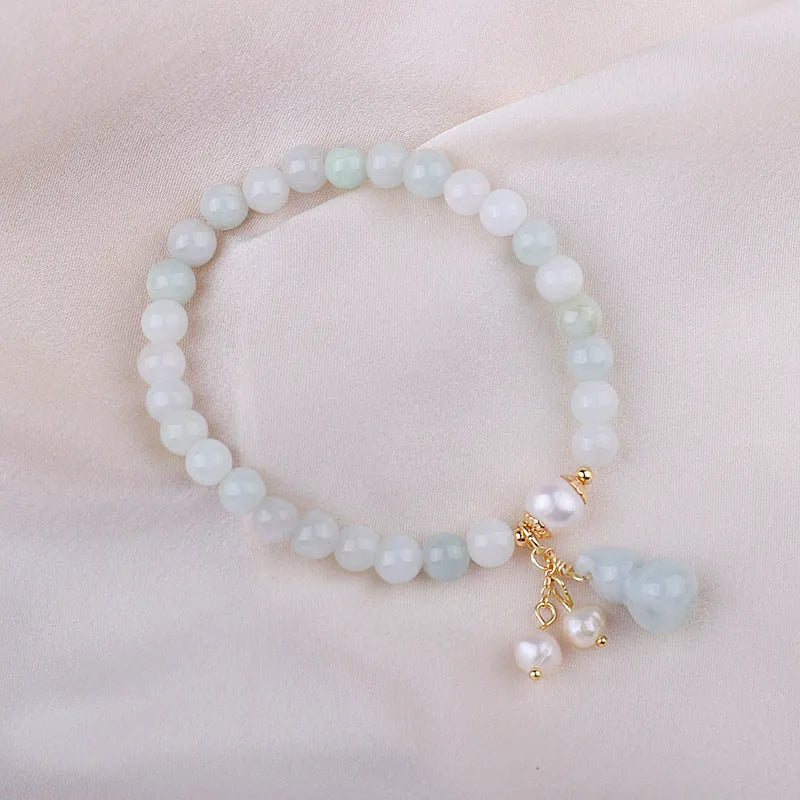 Chinese style jade bracelet with gourd design featuring natural emerald jade ins material.
