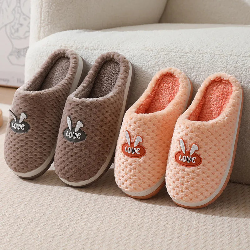 Women's rabbit plaid artificial fur slippers with a thick rubber sole in apricot colour.