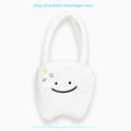 White plush shoulder tote bag with large tooth design and cute teeth pattern, showing zipper closure
