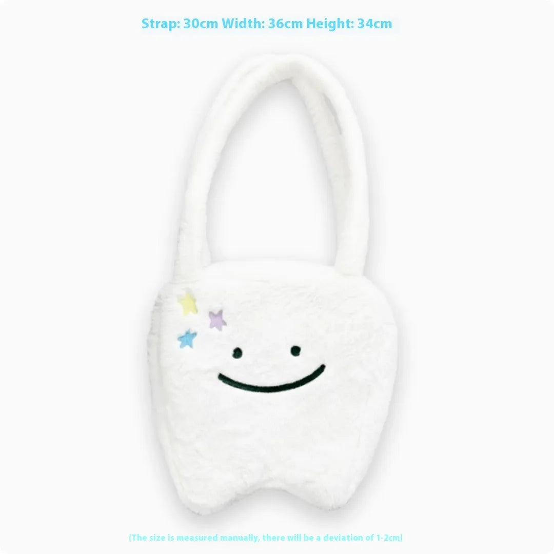 White plush shoulder tote bag with large tooth design and cute teeth pattern, showing zipper closure