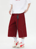 Retro multi-pocket denim workwear shorts in wide leg cropped trousers style