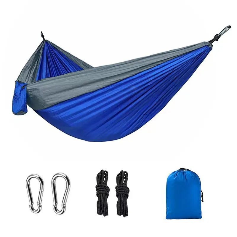 Blue nylon parachute cloth hammock 270x140cm suspended outdoors for camping