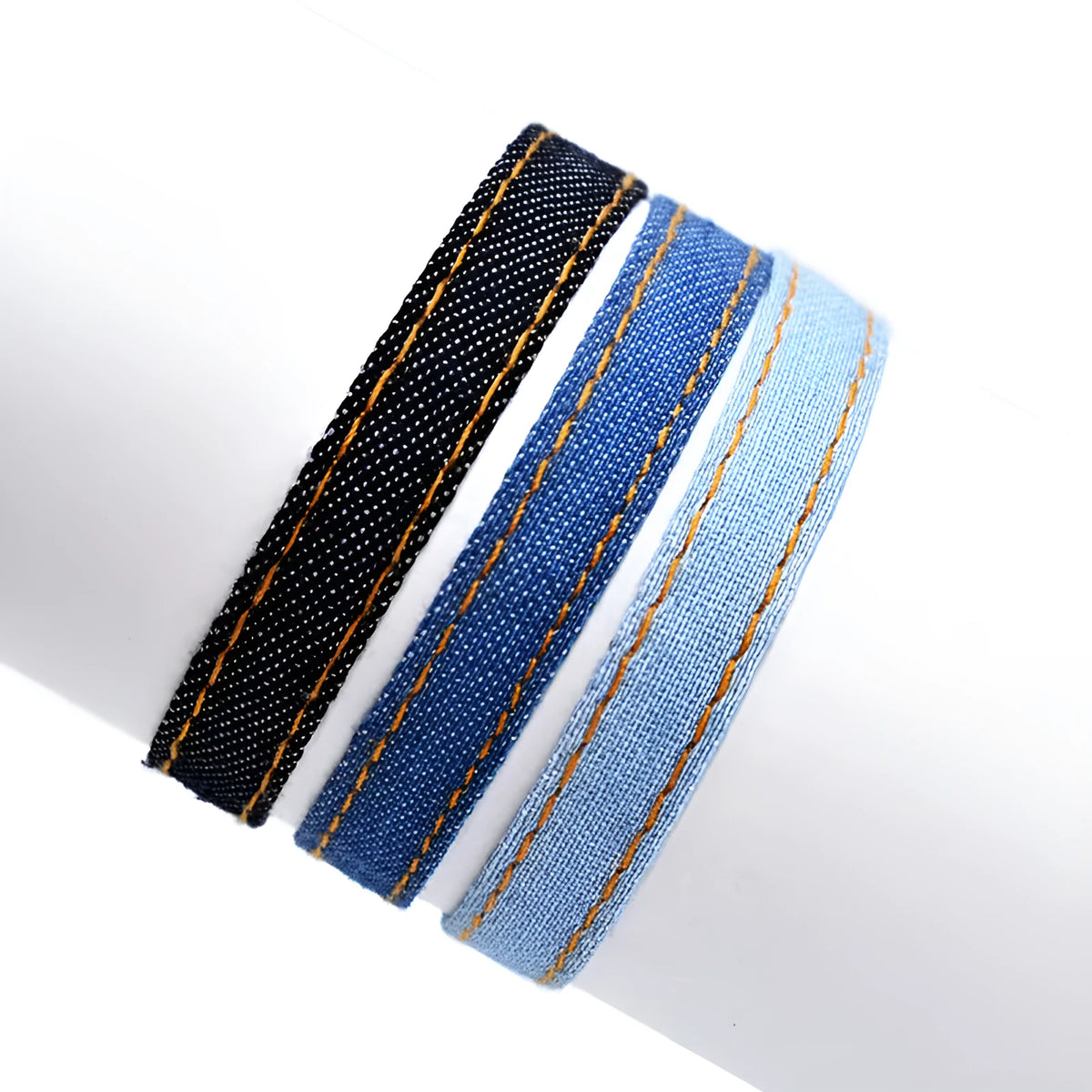 National style denim fabric unisex bracelet carrying strap laid flat.