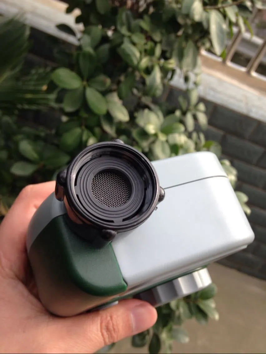 Green digital hose faucet timer with copper connector for automatic garden watering systems