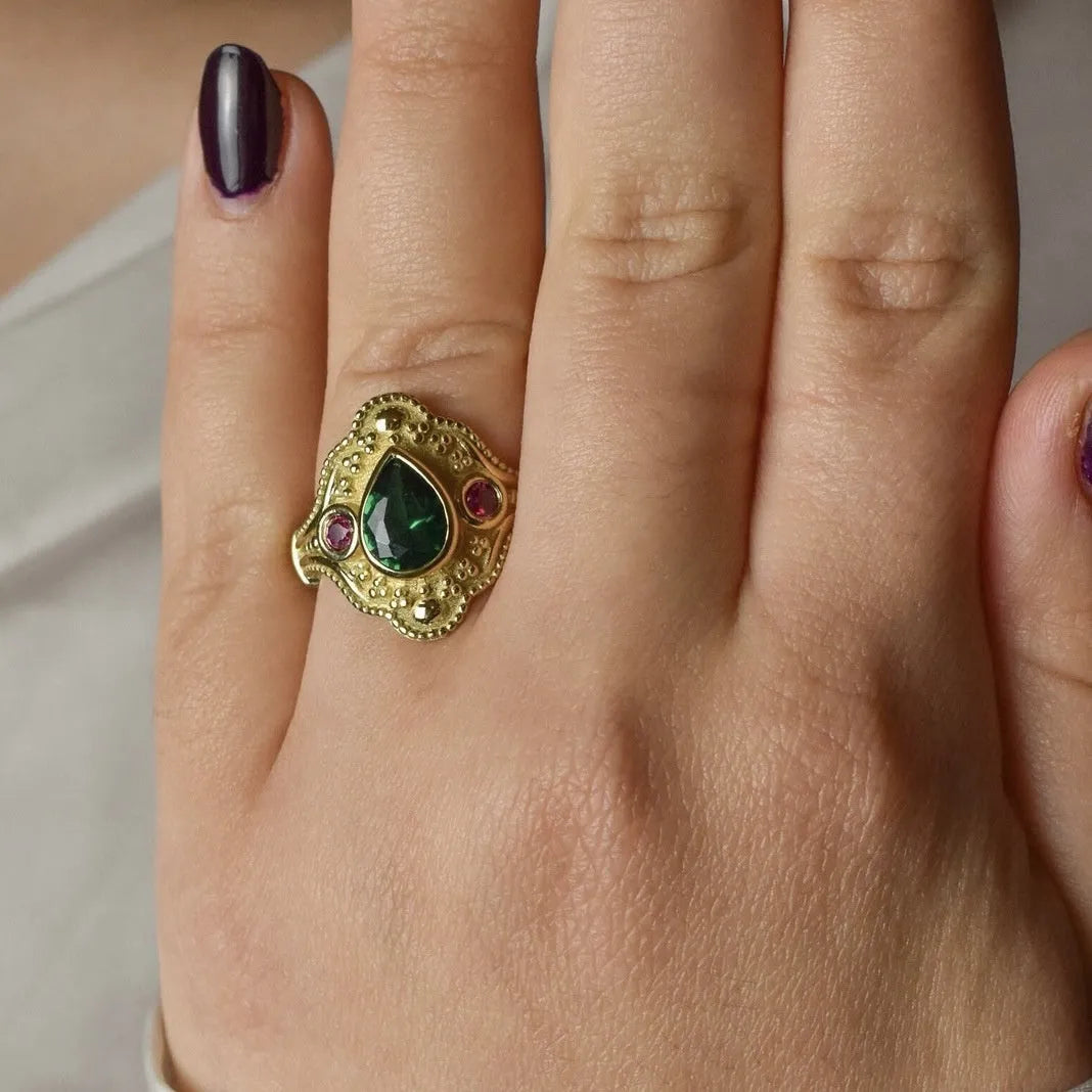 Golden geometric women's alloy ring with gold-plated electroplated finish.