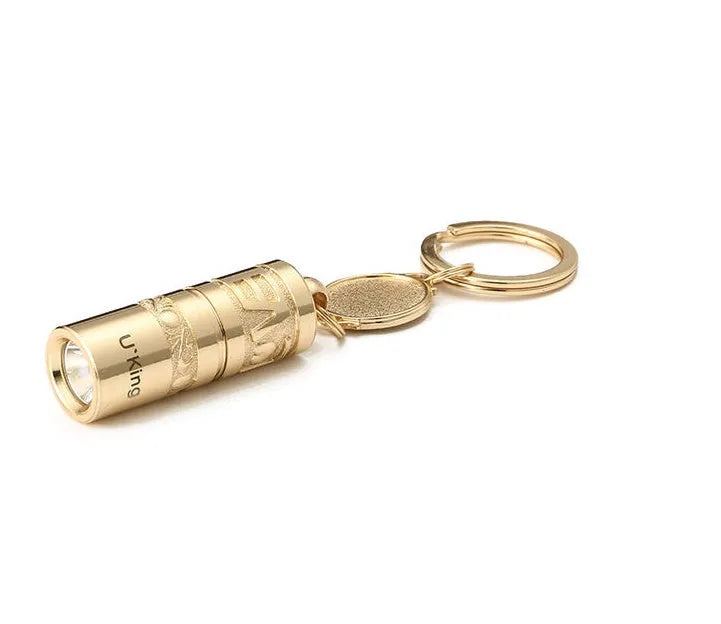 Gold-coloured zinc alloy mini LED keychain flashlight with a keyring.