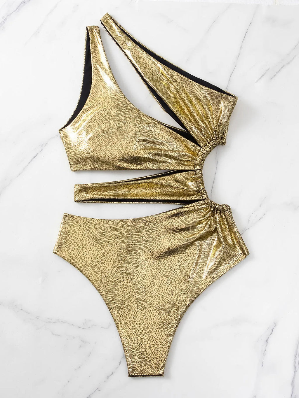 Gold backless one-piece swimsuit for women on a white background.