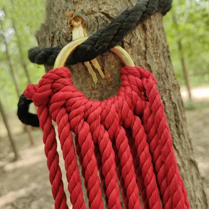 Nylon rope mesh outdoor hammock showing bold pattern construction with tying equipment