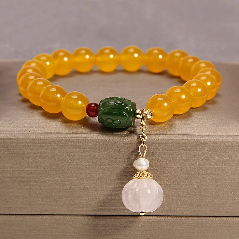 Women's yellow agate crystal bracelet on a gold silk cord, khaki colour.