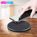 Black Qi wireless charging pad for iPhone 11 with non-slip surface and LED indicator