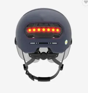 Adult cycling helmet with integrated red LED brake light on the rear, shown in two style options.