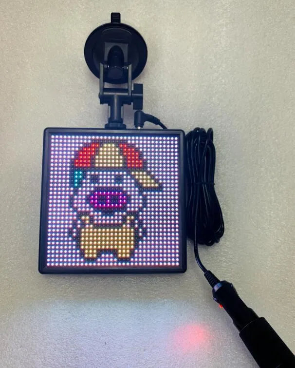 Square LED car display screen with aluminium frame showing 32x32 pixel RGB matrix and Bluetooth connectivity