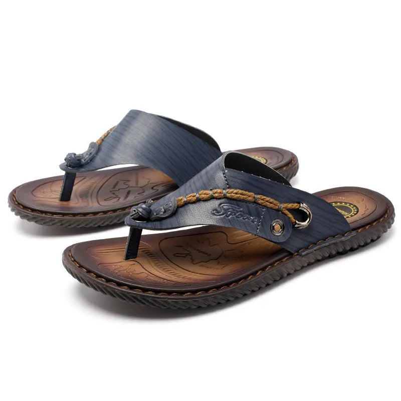 Men's dark blue herringbone-patterned outdoor slippers with a leather lining and rubber sole, shown in a large size.