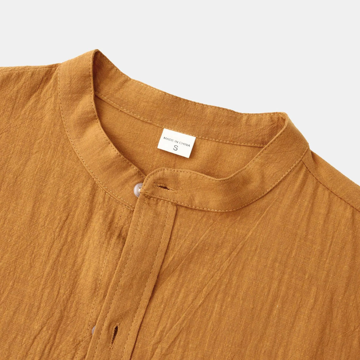 Men's slim fit brown long sleeve shirt and matching casual trousers on a hanger.