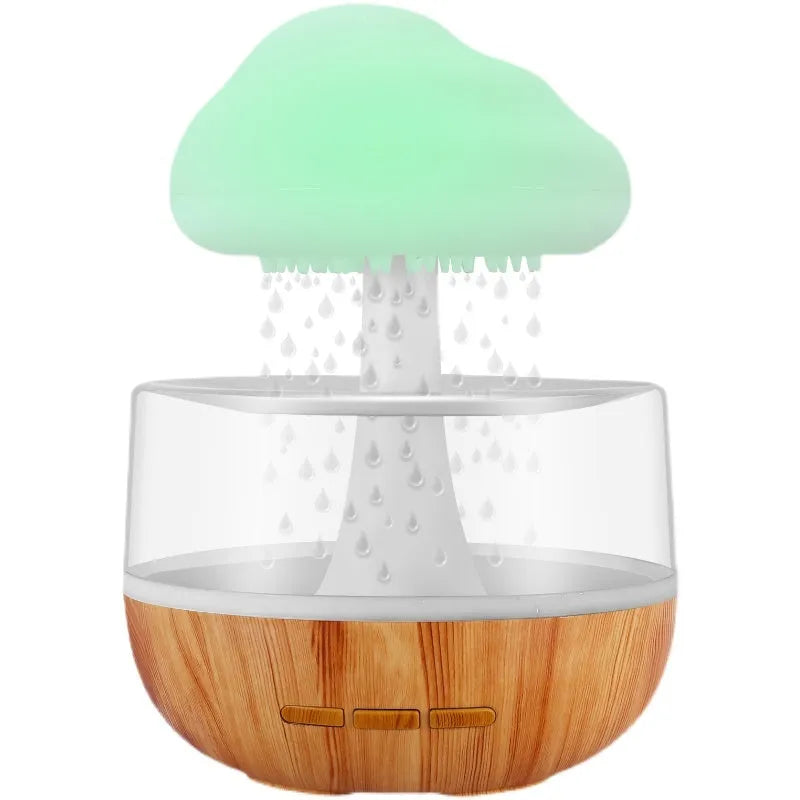 White cloud-shaped humidifier with night lights and water droplet effect on desktop