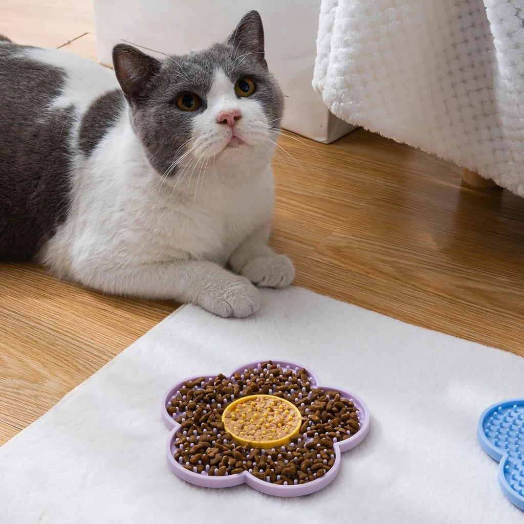 Flower-shaped silicone lick mat for dogs and cats with suction cups on the back, in assorted colours.