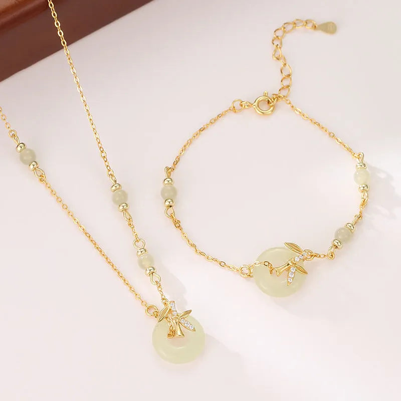 Women's antique-style 925 silver bracelet with Hetian jade and a gold-toned safety buckle clasp.