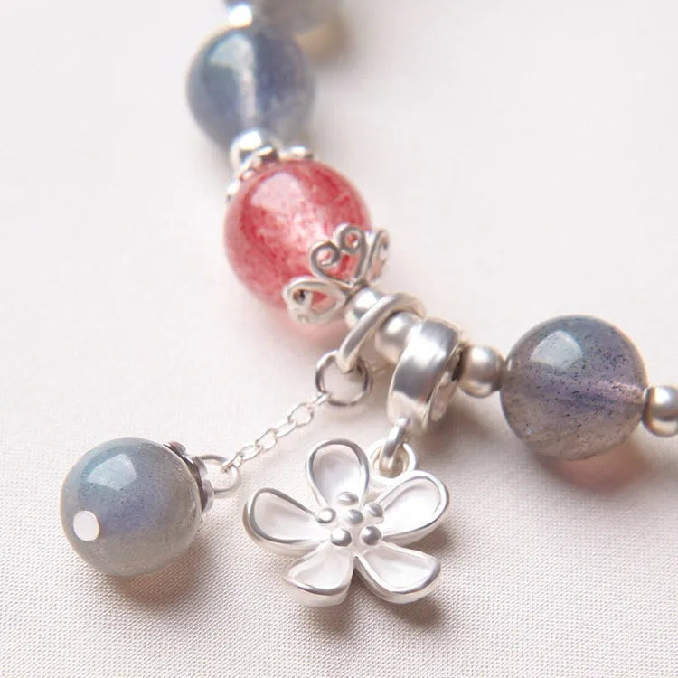 925 sterling silver honeysuckle bracelet with moonlight lime and strawberry crystals on wrist