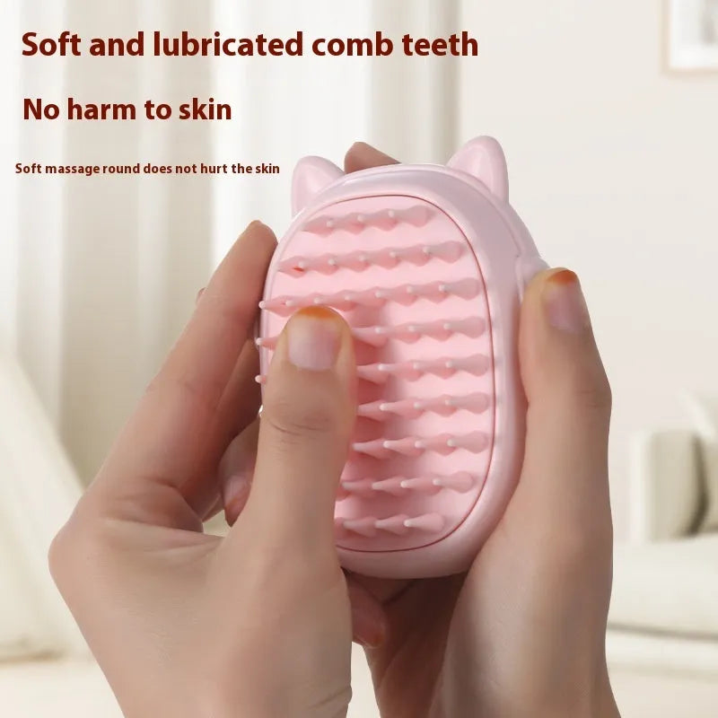 Pink and yellow pet comb with built-in laser pointer for cats and dogs