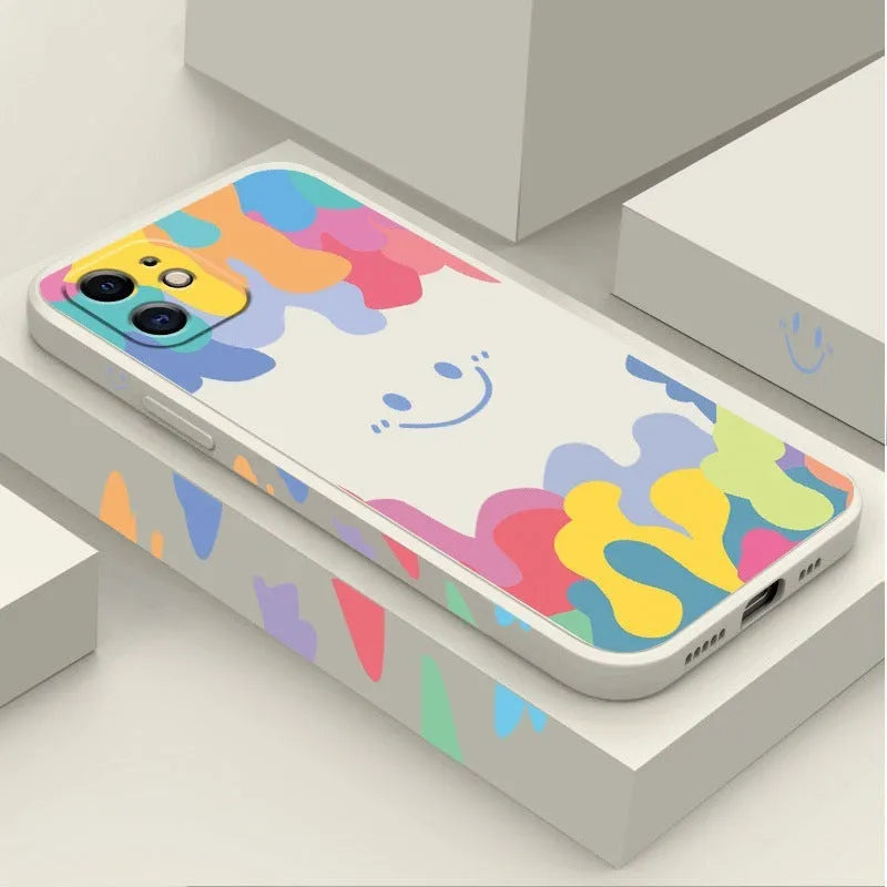 Colourful rainbow smiley face design on white TPU iPhone case with attached lanyard