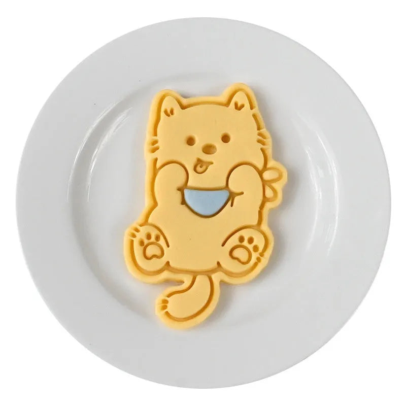 Three dimensional plastic biscuit mould showing puppy cartoon design impressions